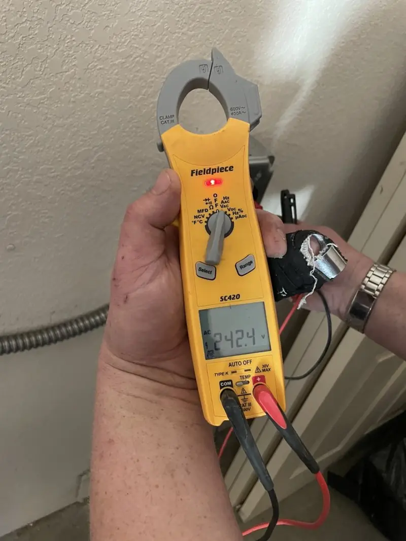Voltage testing with clamp meter during Recessed Lighting Installation in White Bear Lake